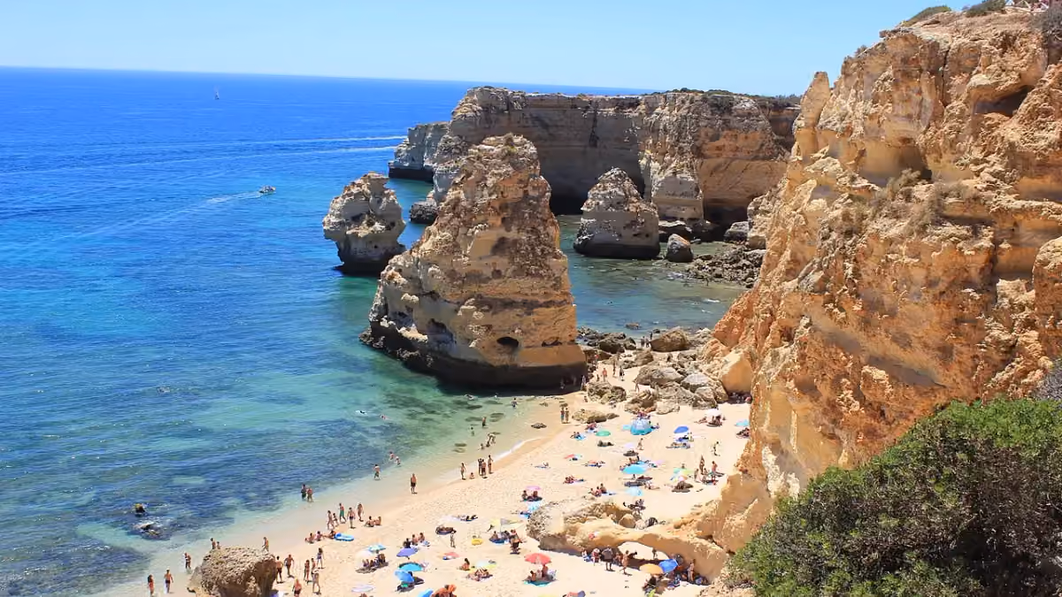 Praia da Marinha’s beach and limestone cliffs in Portugal’s Algarve