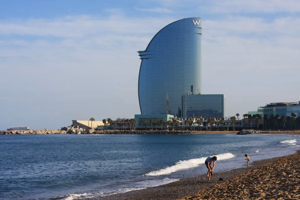 People walking along the beach at Barcelona’s waterfront