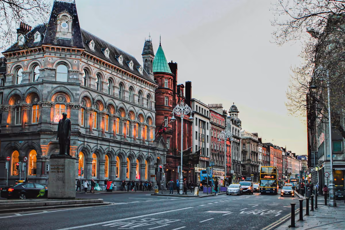 Historic corner building and clock tower on a Dublin street