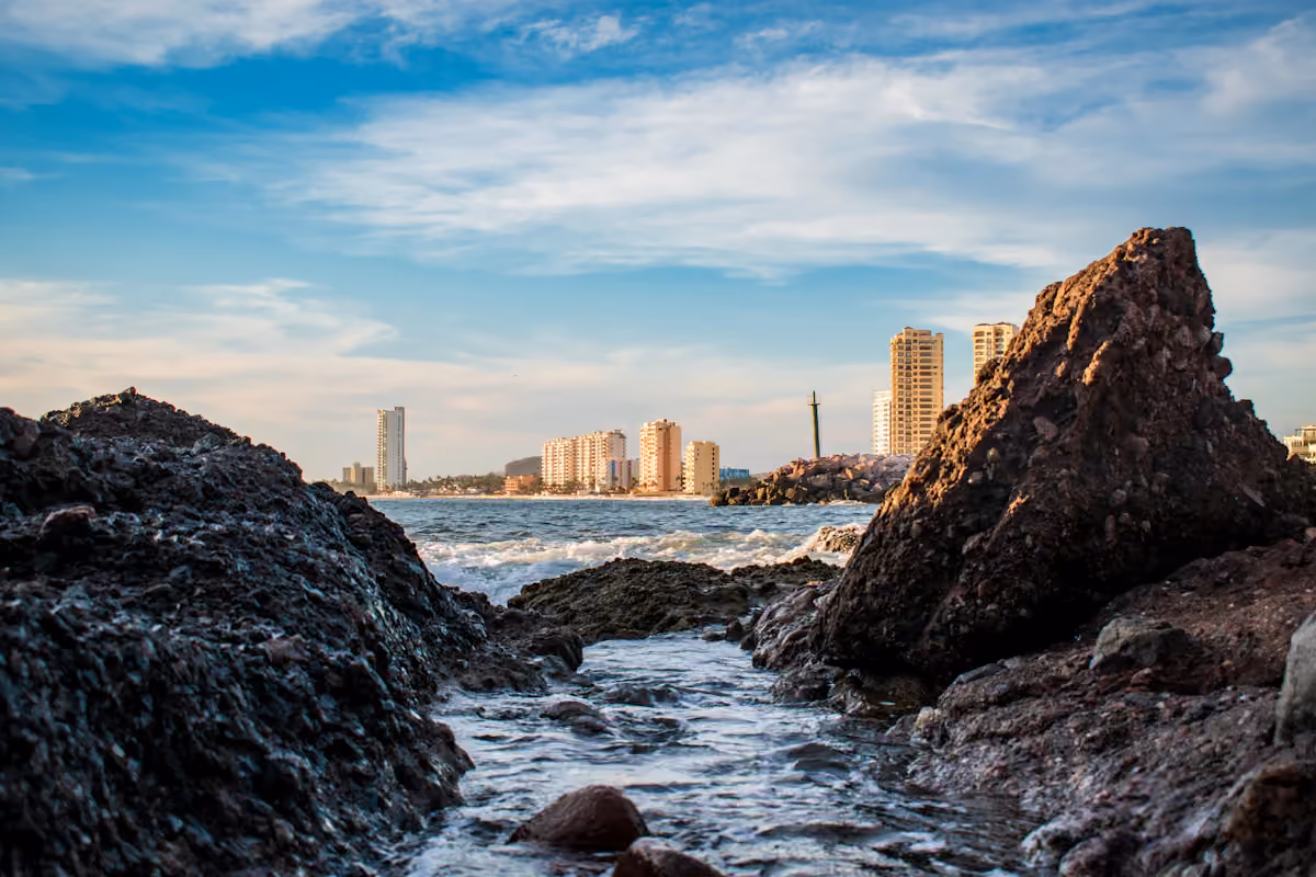 Waves breaking on rocks beside the Mazatlán waterfront
