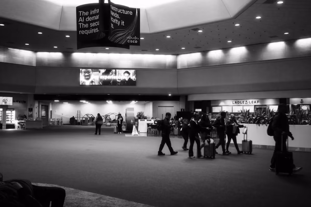 Travelers with luggage walking through a terminal at San Francisco International Airport