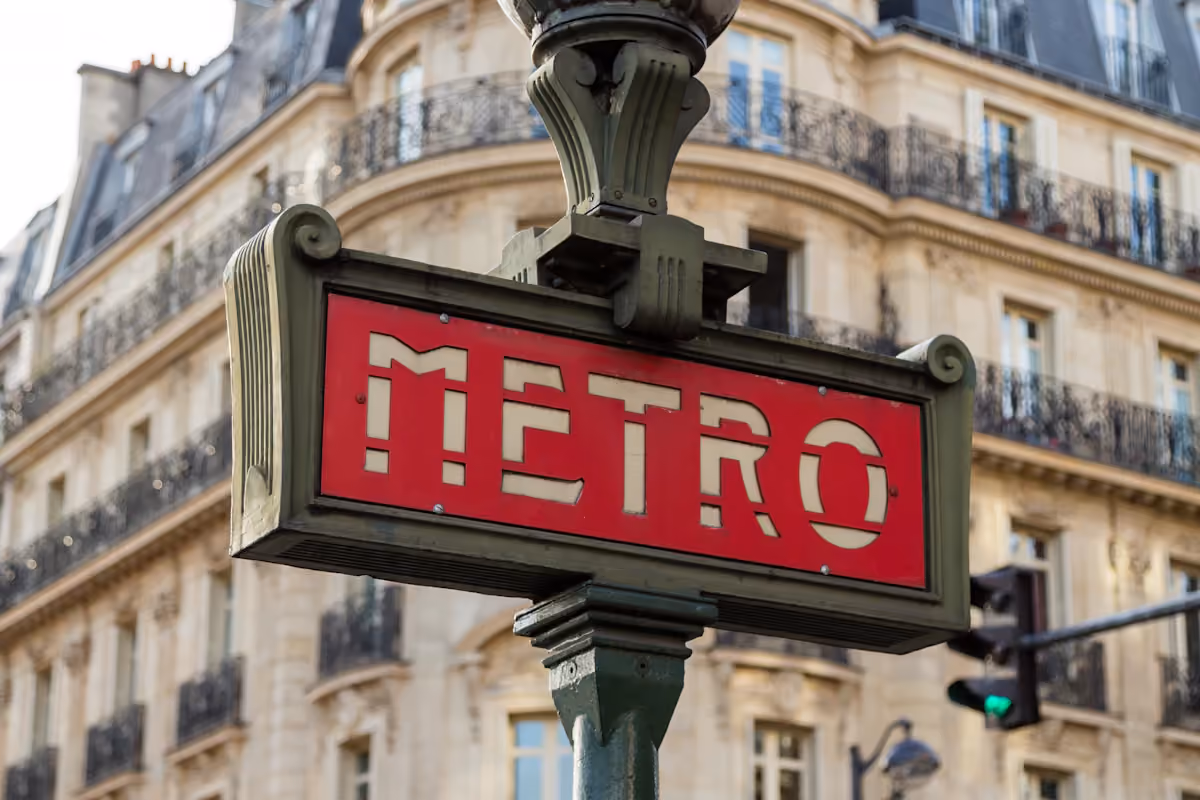 Red Metro sign outside an underground station in Paris