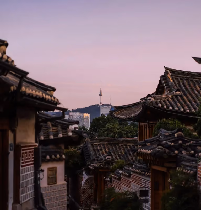 A public street and traditional hanok rooftops in Bukchon, Seoul